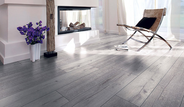Modern interior design with a rustic-style wooden parquet floor that emphasizes the natural wood grain, complementing the cozy atmosphere of the space.